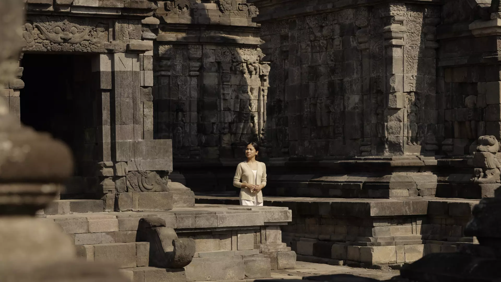 A woman exploring the Candi Sewu Temple 